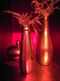 Close-up of illuminated bottle on table