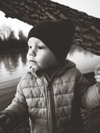 Portrait of boy looking at lake