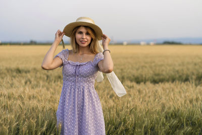 Young woman standing in a field