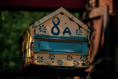 Close-up of birdhouse on wood