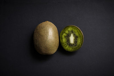 Close-up of fruits against black background