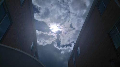 Low angle view of building against cloudy sky