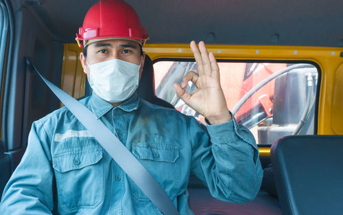 Portrait of man working in bus