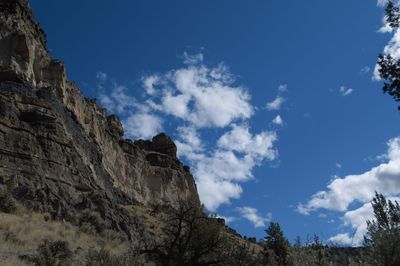 Low angle view of rock formation against sky