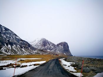 Scenic view of snowcapped mountains against clear sky