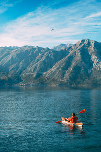 Scenic view of lake against mountain range