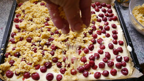 Cropped hand preparing food