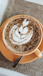 Close-up of cappuccino on table