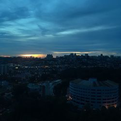 High angle view of city against cloudy sky