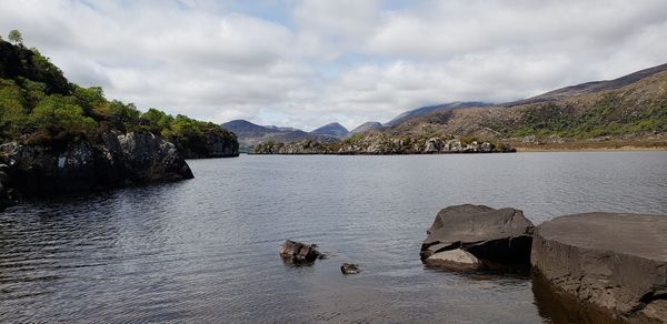 Scenic view of lake and mountains against sky