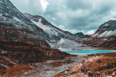 Scenic view of mountain against cloudy sky