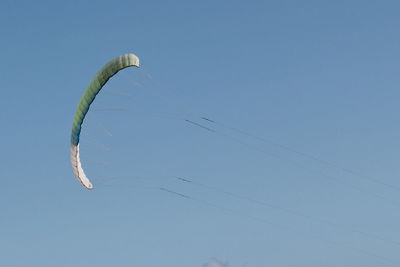 Low angle view of balloons against blue sky