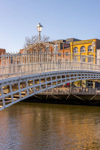Bridge over river against clear sky