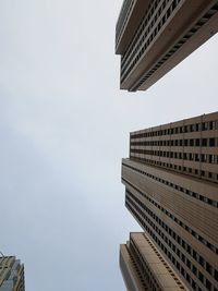 Low angle view of modern buildings against clear sky