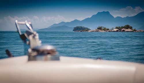 Scenic view of sea with mountains in background