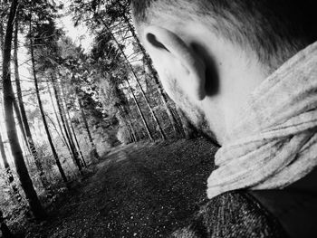 Close-up portrait of man in forest