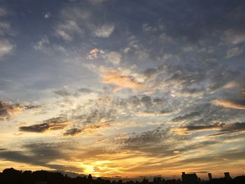 Low angle view of dramatic sky during sunset