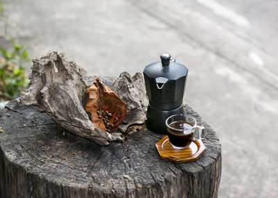 Close-up of coffee cup on wooden table