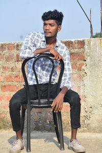 Young woman sitting on chair