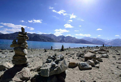 Scenic view of mountains against blue sky