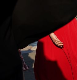 Close-up of hand on red mirror