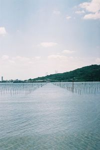 Pier over sea against sky