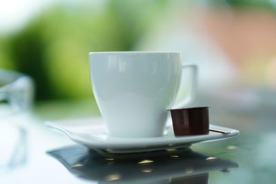 Close-up of coffee cup on table