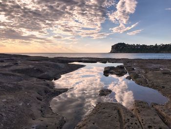 Scenic view of sea against sky at sunset