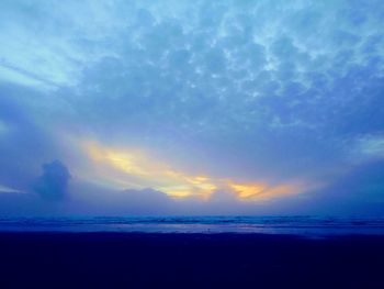 Scenic view of sea against sky at sunset
