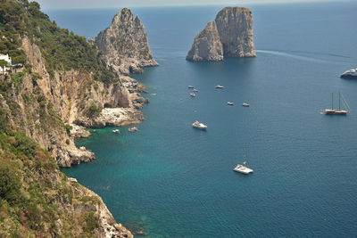 High angle view of rocks in sea