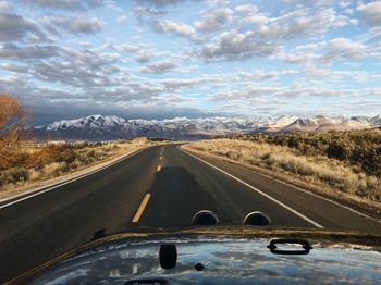 Cars on road against sky