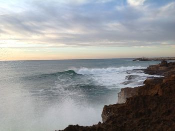 Scenic view of sea against dramatic sky