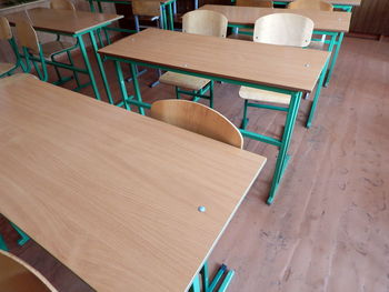 High angle view of empty chairs and tables