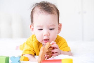 Close-up of cute boy with toy blocks