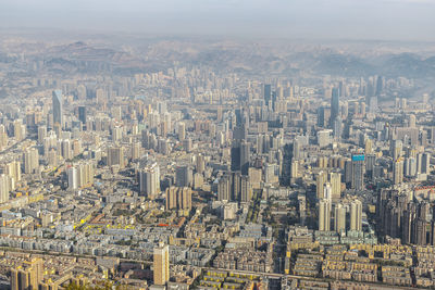 Aerial view of cityscape against sky