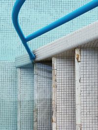 High angle view of blue metal fence