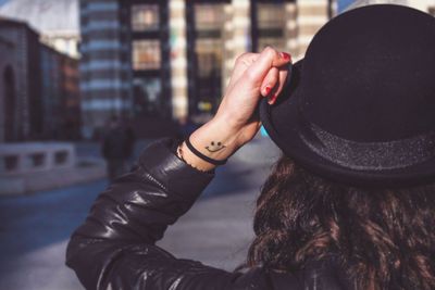 Rear view of woman wearing hat