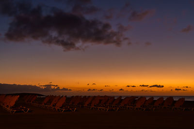 Scenic view of field against sky during sunset