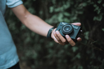 Close-up of hand holding camera