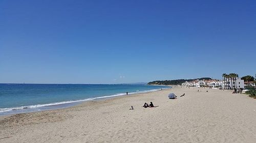 Scenic view of sea against blue sky