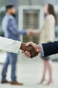 Close-up of business people shaking hands