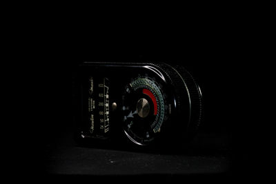 Close-up of camera against black background