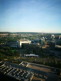 High angle view of city buildings against clear sky