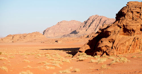 Rock formations in desert against clear sky