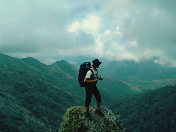 Full length of man standing on mountain