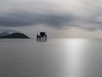 Scenic view of sea against sky at dusk