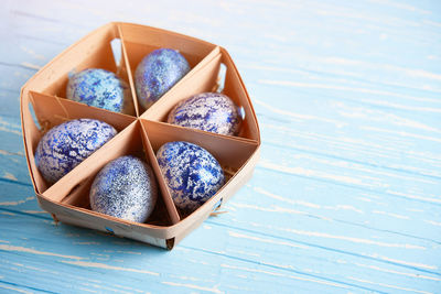 High angle view of bread in box on wooden table