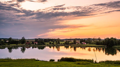 Scenic view of lake against sky during sunset