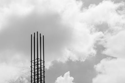 Low angle view of silhouette tower against sky