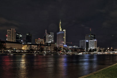 Illuminated city at waterfront